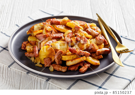 Bratkartoffeln, german potato with bacon and onion Bratkartoffeln, german potato with bacon and onion 85150237
