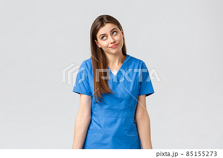 Healthcare workers, prevent virus, insurance and medicine concept. Indecisive and unsure cute doctor, female nurse in blue scrubs, cant tell, have no idea, shrugging and look away uncertain Healthcare workers, prevent virus, insurance and medicine concept. Indecisive and unsure cute doctor, female nurse in blue scrubs, cant tell, have no idea, shrugging and look away uncertain 85155273