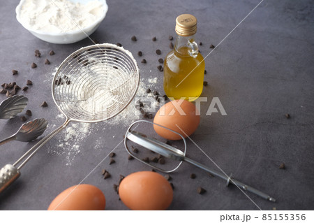 Baking ingredients on a black background, top view. 85155356