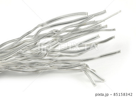 White plastic coated wire tie used for a variety of things on white background. White plastic coated wire tie used for a variety of things on white background. 85158342