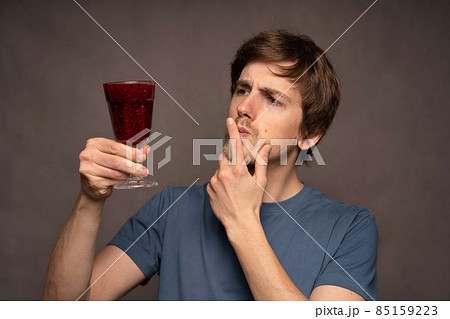 Young white man on grey background 85159223
