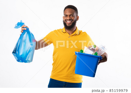 Black Man Holding Garbage Bag And Box Over White Background 85159979