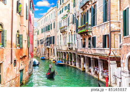 Venice canal and famous gondola, romantic view of Italy 85165037