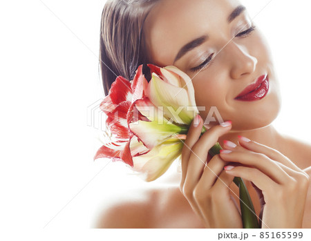 young pretty brunette real woman with red flower amaryllis isolated on white background close up young pretty brunette real woman with red flower amaryllis isolated on white background close up 85165599