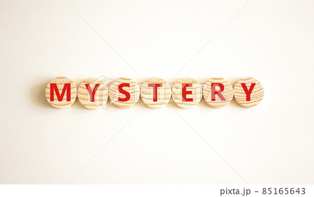 Mystery symbol. The concept word Mystery on wooden circles. Beautiful white background, copy space. Business and mystery mysterious concept. Mystery symbol. The concept word Mystery on wooden circles. Beautiful white background, copy space. Business and mystery mysterious concept. 85165643