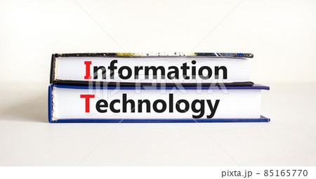 IT, information technology symbol. Concept words 'IT, information technology' on books on a beautiful white table, white background. Business, IT, information technology concept, copy space. IT, information technology symbol. Concept words 'IT, information technology' on books on a beautiful white table, white background. Business, IT, information technology concept, copy space. 85165770