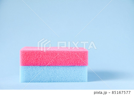 Colorful washcloths and bars of soap on a blue background. Accessories for body care and hygiene. Colorful washcloths and bars of soap on a blue background. Accessories for body care and hygiene. 85167577