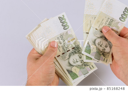 Czech koruna CZK banknote is counting in hand Czech koruna CZK banknote is counting in hand 85168248
