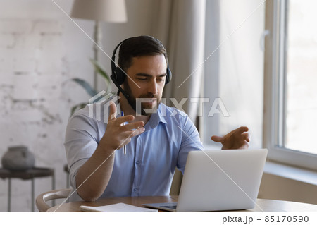 Happy smart young businessman communicating by video call. 85170590