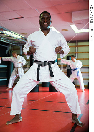 A Man, In A Black Kimono Is Practicing Martial Arts Technique With A Long  Bamboo Fighting Stick. Stock Photo, Picture and Royalty Free Image. Image  91980191.