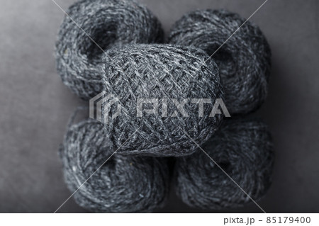 Tangles of gray yarn made of natural wool close-up 85179400