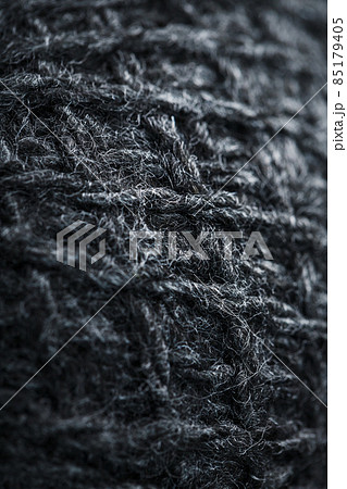 Gray threads of natural wool close-up in full screen. 85179405