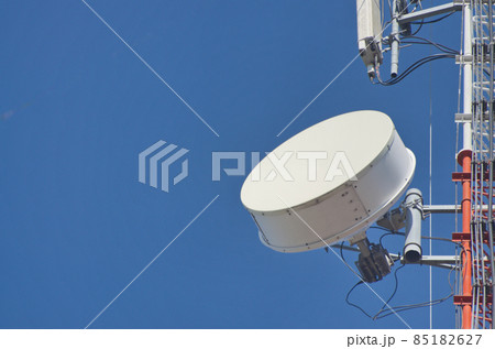 Internet towers and transmission equipment on clean blue sky background Internet towers and transmission equipment on clean blue sky background 85182627