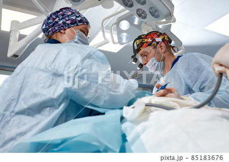 A team of surgeons is fighting for life, for a real operation, for real emotions. The intensive care team is fighting for the life of the patient. Saving life, the struggle for life A team of surgeons is fighting for life, for a real operation, for real emotions. The intensive care team is fighting for the life of the patient. Saving life, the struggle for life 85183676