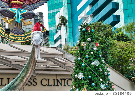 Christmas decorated Dinosaur sculpture at the entrance of BDMS Wellness Clinic 85184409