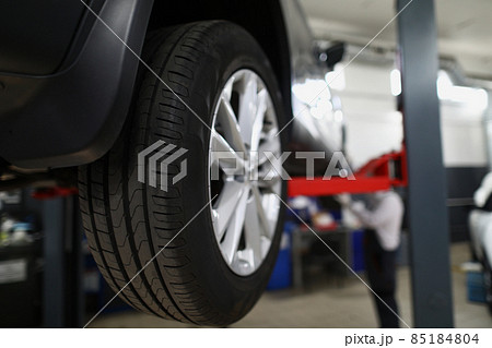 Brand new automobile tire, changed part of vehicle in service centre 85184804