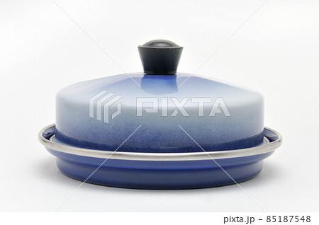 Blue enamelled metal dish for butter on white background 85187548