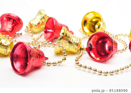 Christmas bells of red and gold color with a chain on a white background Christmas bells of red and gold color with a chain on a white background 85188090