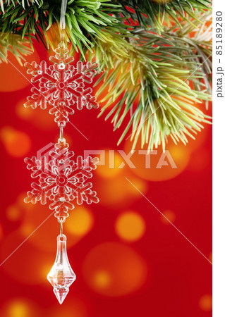 Christmas ornaments crystal snowflake on green branch background 85189280