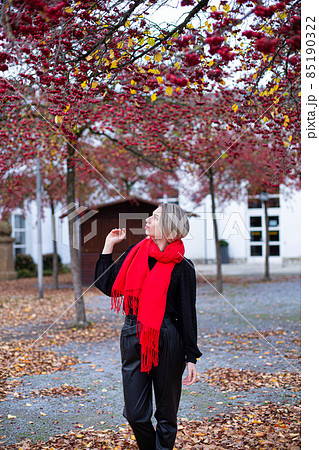 Woman in red scarf in autumn 85190322
