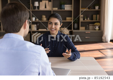Happy Indian female client consulting male business professional 85192543