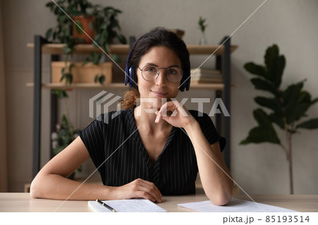 Headshot portrait of young hispanic woman professional teacher wearing headphones Headshot portrait of young hispanic woman professional teacher wearing headphones 85193514