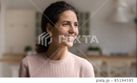 Head shot smiling woman looking to aside, dreaming of future 85194595