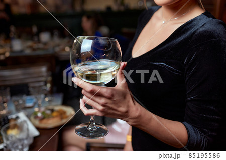 close-up of gorgeous woman with a glass of champagne. party and holiday celebration. close-up of gorgeous woman with a glass of champagne. party and holiday celebration. 85195586