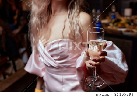 close-up of gorgeous woman with a glass of champagne. party and holiday celebration. close-up of gorgeous woman with a glass of champagne. party and holiday celebration. 85195593