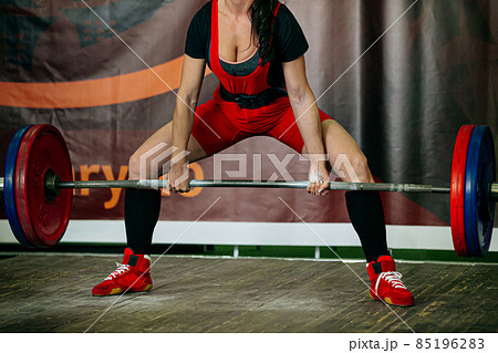 female athlete exercise deadlift in powerlifting competition 85196283