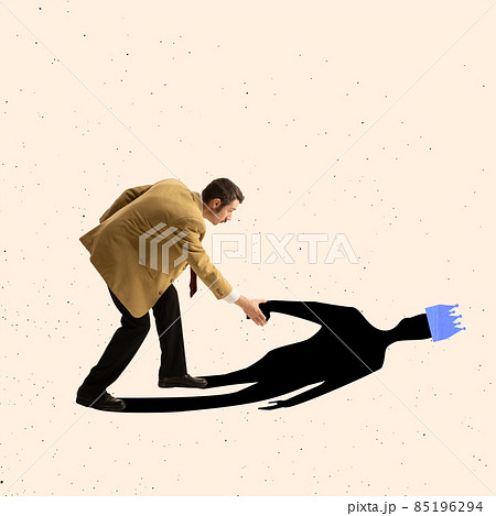 Contemporary art collage of businessman holding hand of his shadow and helping it to stand up 85196294