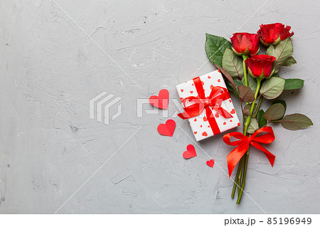 Valentine's day composition with rose flower, red heart and gift boxes on table. mother day and birthday greeting, copy space, top view Valentine's day composition with rose flower, red heart and gift boxes on table. mother day and birthday greeting, copy space, top view 85196949