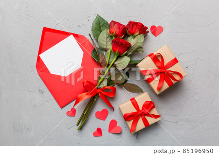 Valentine day composition with Envelope, rose flower and Red heart on table. Top view, flat lay. Holiday concept Valentine day composition with Envelope, rose flower and Red heart on table. Top view, flat lay. Holiday concept 85196950