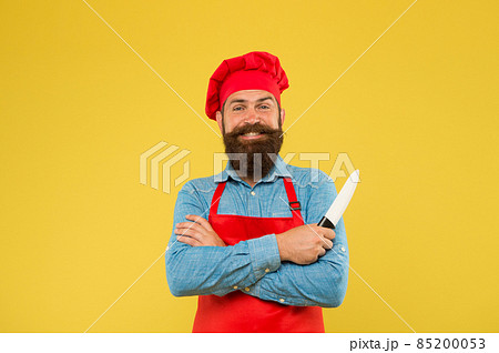 Hipster cook chopping and dicing using professional knife Hipster cook chopping and dicing using professional knife 85200053