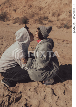 A man and a woman enjoy each other on the seashore. A man and a woman enjoy each other on the seashore. 85200103