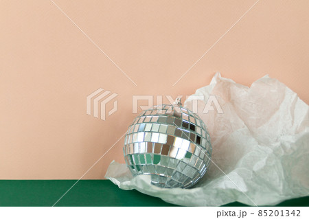 silver disco ball reflecting lights on pink background, greeting card wallpaper template with empty space for text silver disco ball reflecting lights on pink background, greeting card wallpaper template with empty space for text 85201342