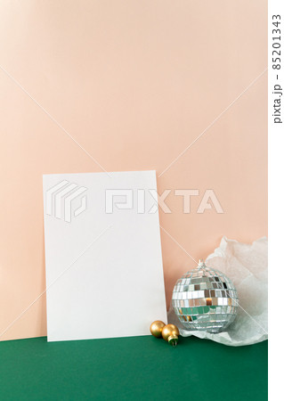 silver disco ball reflecting lights on pink background, greeting card wallpaper template with empty space for text 85201343