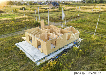 Construction of new and modern modular house. Walls made from composite wooden sip panels with styrofoam insulation inside. Building new frame of energy efficient home concept. 85201849