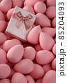 beauty background a bunch of pink gentle makeup sponges and a pink gift vertical orientation 85204093