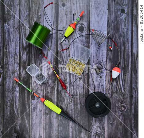 flat bed with fishing gear and hooks on wooden boards flat bed with fishing gear and hooks on wooden boards 85205414