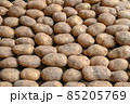 Potatoes for sale at vegetable market, close up. Boxes full of potatoes in shop. Fresh potato at the greengrocer's stall.   85205769
