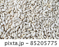 Fresh white beans for sale at vegetable market, close up. Boxes full of raw beans in shop. Organic bean at the greengrocer's stall. Vegetable. 85205775