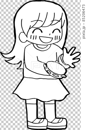A child playing a tambourine with a smile 85206473