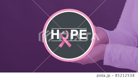 Woman with hope text and breast cancer awareness ribbon on purple background, copy space 85212538
