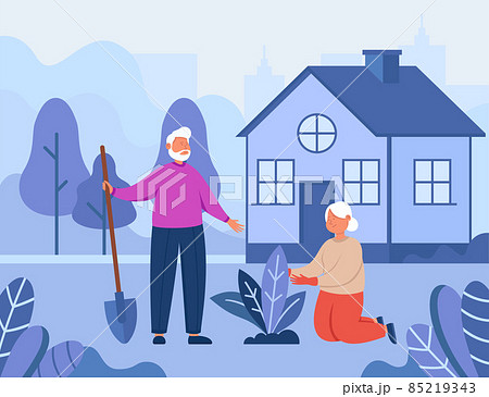 Old grandparents putting plant in soil in garden Old grandparents putting plant in soil in garden 85219343