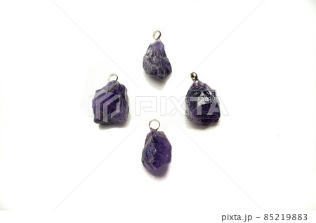 Natural violet amethyst rough pendant on the white background 85219883