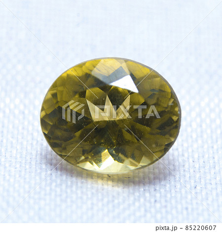 Macro natural yellow apatite on the white background 85220607
