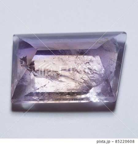 Natural yellow and purple ametrine on the white background 85220608