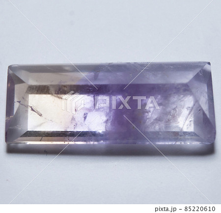 Natural yellow and purple ametrine on the white background 85220610