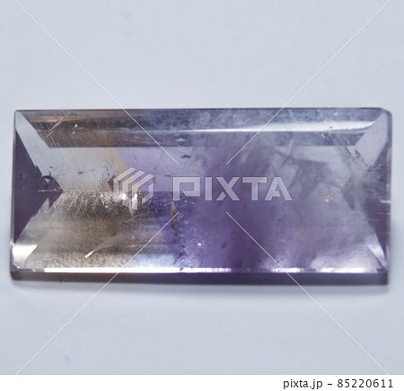 Natural yellow and purple ametrine on the white background 85220611
